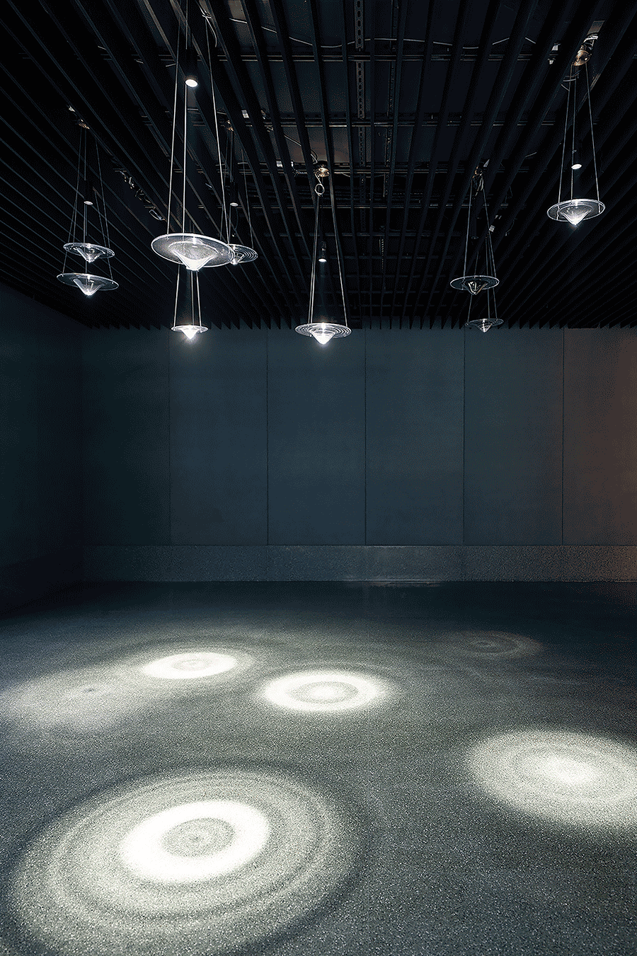 Raindrop pendant lights glowing and dimming.